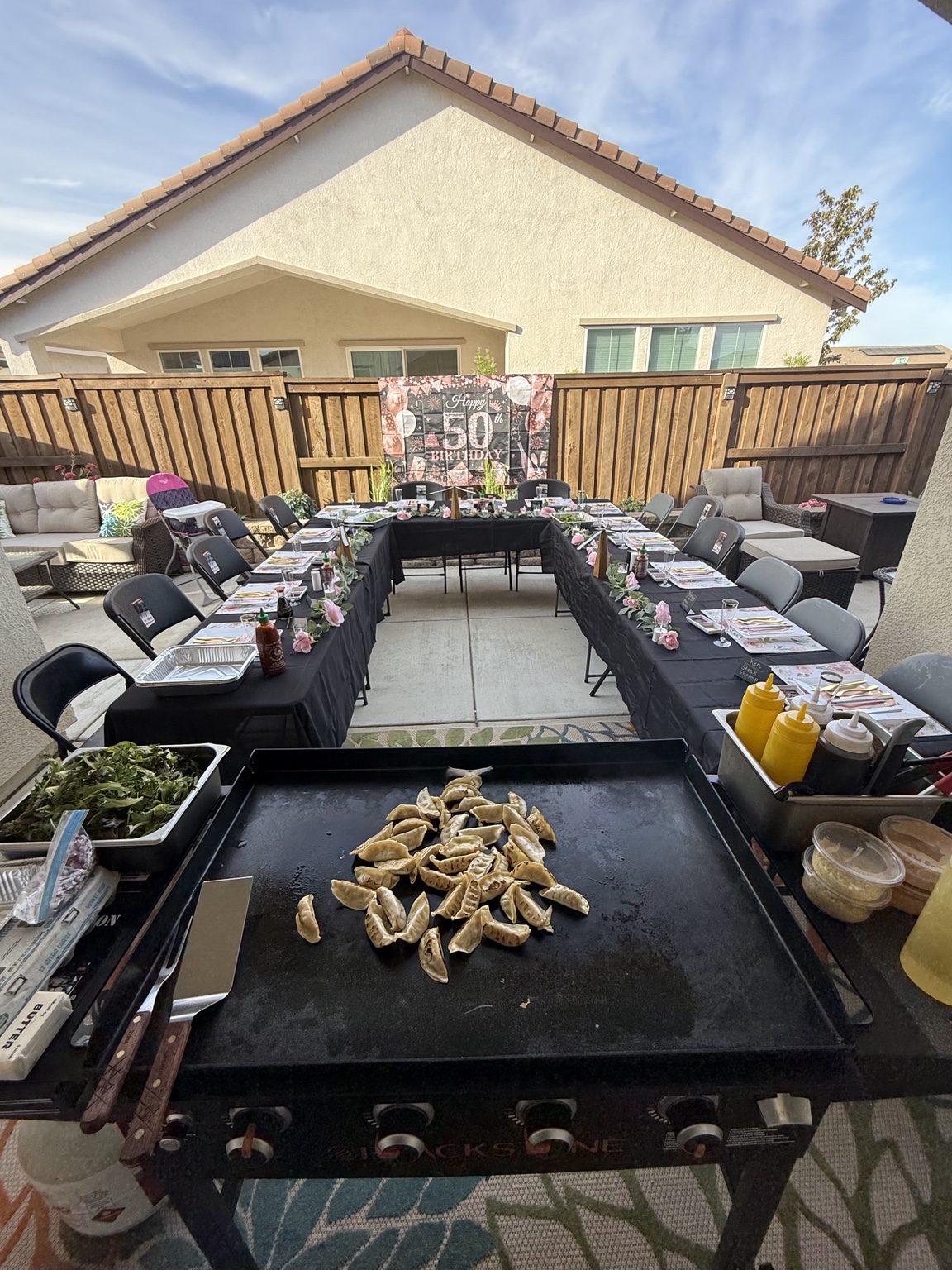 Birthday hibachi table set with gyoza on the grill